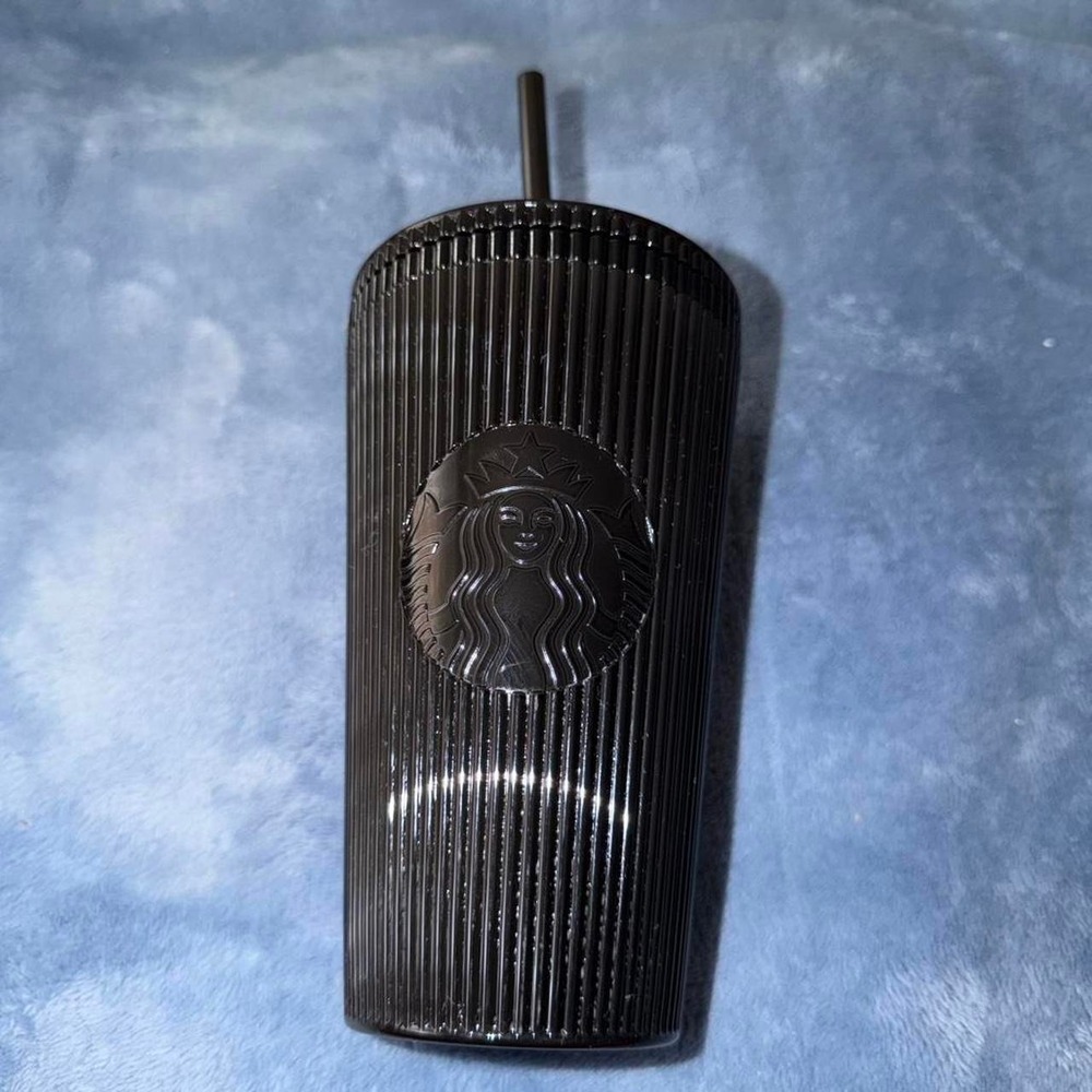 Black Starbucks tumbler with straw